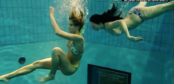  Two sexy amateurs showing their bodies off under water